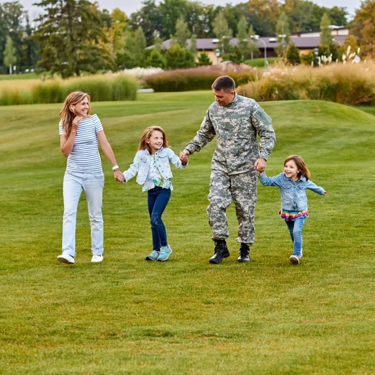 Soldier walking with kids and wife